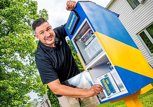 NIC ADAM / FREE PRESS
AJ Ongenae pictured alongside the Blockbuster themed little library on the front lawn of his Rossmere home.
240709 - Tuesday, July 09, 2024.

Reporter: Jura