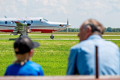 NIC ADAM / FREE PRESS
St. Andrews Airport is celebrating its 60th anniversary this month since it first opened.
Ian Harasymiw and his grandson Sheamus watch planes take off at St. Andrews Airport on Monday morning.
240708 - Monday, July 08, 2024.

Reporter: Matt Frank