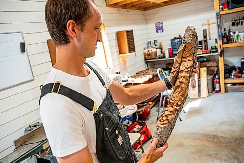 NIC ADAM / FREE PRESS
Wood carver Lucas Kost, 28, in his home-garage studio on Wednesday morning.
240710 - Wednesday, July 10, 2024.

Reporter: Dave