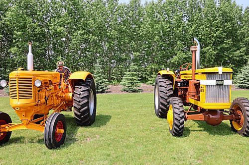 Mark Phillips' restored 1955 U-Diesel (left) and 1963 G706 tractors sit in his field at Forrest. (Abiola Odutola/The Brandon Sun)