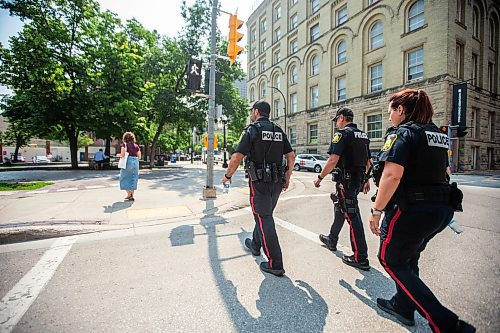 MIKAELA MACKENZIE / FREE PRESS

Foot patrol officers Stephen Desrochers (left), John Middleton, and Vivian Smith (who are part of the Violent Crime Retail Theft Initiative) walk through Old Market Square in the Exchange District on Wednesday, July 10, 2024. 

For Chris story.

