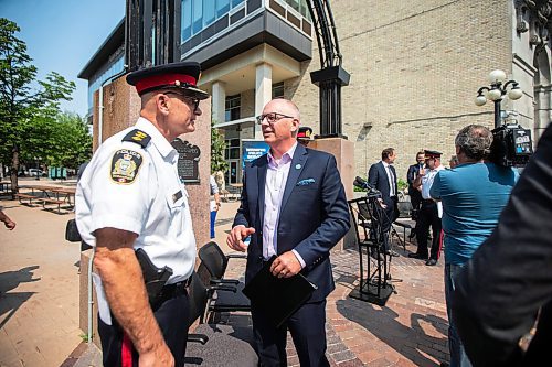 MIKAELA MACKENZIE / FREE PRESS

Mayor Scott Gillingham chats with police after an update on the Violent Crime Retail Theft Initiative at Bijou Park on Wednesday, July 10, 2024. 

For Chris story.

