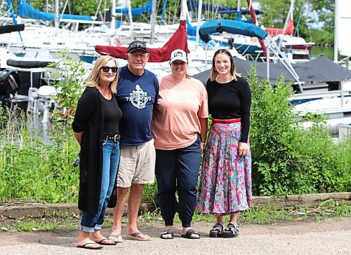 Southwest Community Options (SWOC) executive director Rhonda Beare, Pelican Yacht Club harbour master Dennis Collingwood, yacht club director of sailing Lorna Garabed and SWOC executive assistant Madison Swark pose for a picture at the club's facility in Ninette on Pelican Lake. (Perry Bergson/The Brandon Sun) 