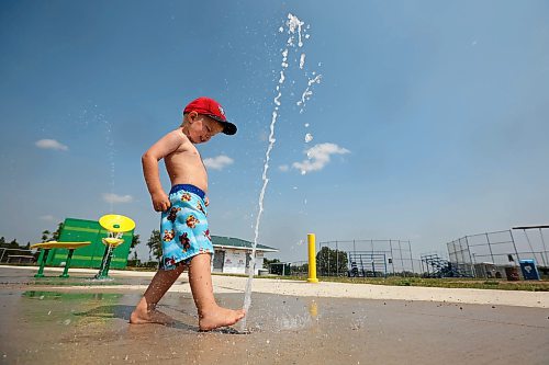 Three-year-old Kesler Davies of Cromer plays in the cool water at the Virden Spray Park on a scorching hot Wednesday afternoon. Environment Canada has forecast the hot spell to last through the weekend before daytime highs return to the mid 20s C early next week. (Tim Smith/The Brandon Sun)