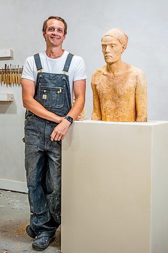 NIC ADAM / FREE PRESS
Wood carver Lucas Kost, 28, in his home-garage studio on Wednesday morning.
240710 - Wednesday, July 10, 2024.

Reporter: Dave