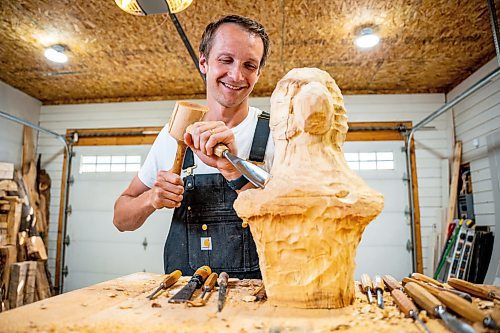 NIC ADAM / FREE PRESS
Wood carver Lucas Kost, 28, in his home-garage studio on Wednesday morning.
240710 - Wednesday, July 10, 2024.

Reporter: Dave