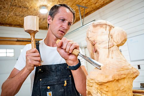 NIC ADAM / FREE PRESS
Wood carver Lucas Kost, 28, in his home-garage studio on Wednesday morning.
240710 - Wednesday, July 10, 2024.

Reporter: Dave