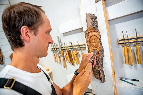 NIC ADAM / FREE PRESS
Wood carver Lucas Kost, 28, in his home-garage studio on Wednesday morning.
240710 - Wednesday, July 10, 2024.

Reporter: Dave