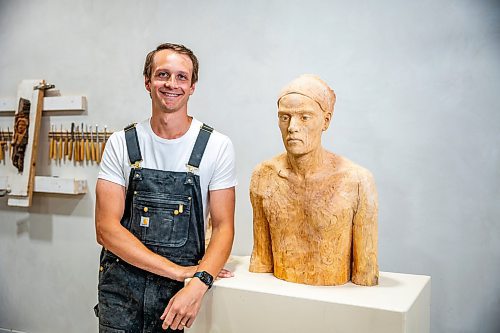 NIC ADAM / FREE PRESS
Wood carver Lucas Kost, 28, in his home-garage studio on Wednesday morning.
240710 - Wednesday, July 10, 2024.

Reporter: Dave