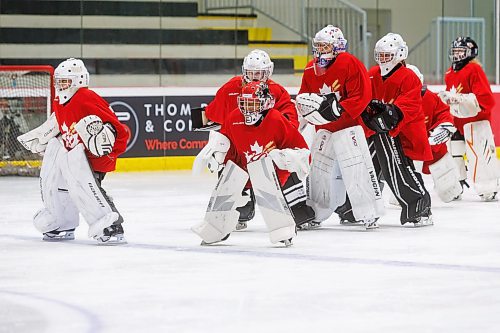 MIKE DEAL / FREE PRESS
At only at 4&#x2019;2&#x201d; tall, ten-year-old, Stephanie Hugh (middle with read helmet), is a ball of energy on the ice Wednesday morning at the Hockey for All Centre, during the Kristen Campbell Elite Goaltending Camp.
See Mike Sawatzky story
240710 - Wednesday, July 10, 2024.