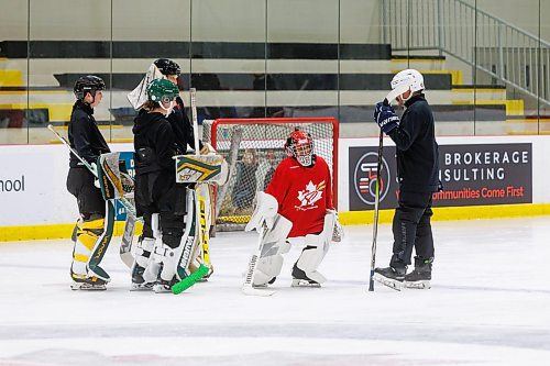 MIKE DEAL / FREE PRESS
At only at 4&#x2019;2&#x201d; tall, ten-year-old, Stephanie Hugh (middle with read helmet), chats up the instructors on the ice Wednesday morning at the Hockey for All Centre, during the Kristen Campbell Elite Goaltending Camp.
See Mike Sawatzky story
240710 - Wednesday, July 10, 2024.