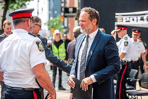 MIKAELA MACKENZIE / FREE PRESS

Justice minister Matt Wiebe (right) chats with WPS inspector Eric Luke after an press conference about the Violent Crime Retail Theft Initiative at Bijou Park on Wednesday, July 10, 2024. 

For Chris story.

