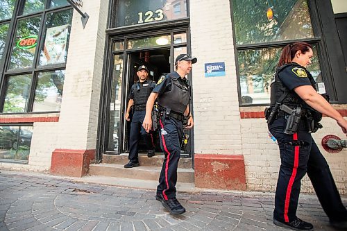 MIKAELA MACKENZIE / FREE PRESS

Foot patrol officers Stephen Desrochers (left), John Middleton, and Vivian Smith (who are part of the Violent Crime Retail Theft Initiative) walk through Old Market Square in the Exchange District on Wednesday, July 10, 2024. 

For Chris story.

