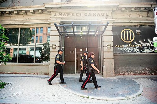 MIKAELA MACKENZIE / FREE PRESS

Foot patrol officers Stephen Desrochers (left), John Middleton, and Vivian Smith (who are part of the Violent Crime Retail Theft Initiative) walk through Old Market Square in the Exchange District on Wednesday, July 10, 2024. 

For Chris story.

