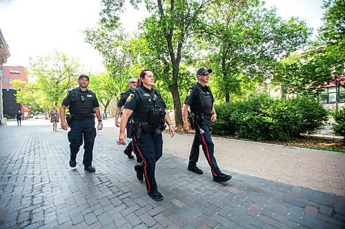 MIKAELA MACKENZIE / FREE PRESS

Foot patrol officers Stephen Desrochers (left), Todd Martens, Vivian Smith, and John Middleton (who are part of the Violent Crime Retail Theft Initiative) walk through Old Market Square in the Exchange District on Wednesday, July 10, 2024. 

For Chris story.

