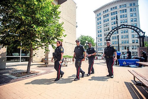 MIKAELA MACKENZIE / FREE PRESS

Foot patrol officers Vivian Smith (left), John Middleton, Stephen Desrochers, and Todd Martens (who are part of the Violent Crime Retail Theft Initiative) walk through Old Market Square in the Exchange District on Wednesday, July 10, 2024. 

For Chris story.

