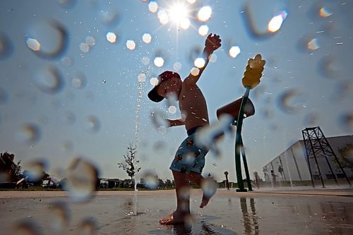 10072024
Three-year-old Kesler Davies of Cromer plays in the cool water at the Virden Spray Park on a scorching hot Wednesday afternoon. Environment Canada has forecast the heatwave to last through the weekend before daytime highs return to the mid 20&#x2019;s early next week.
(Tim Smith/The Brandon Sun)