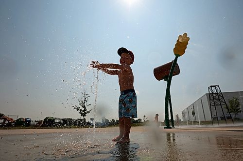 10072024
Three-year-old Kesler Davies of Cromer plays in the cool water at the Virden Spray Park on a scorching hot Wednesday afternoon. Environment Canada has forecast the heatwave to last through the weekend before daytime highs return to the mid 20&#x2019;s early next week.
(Tim Smith/The Brandon Sun)