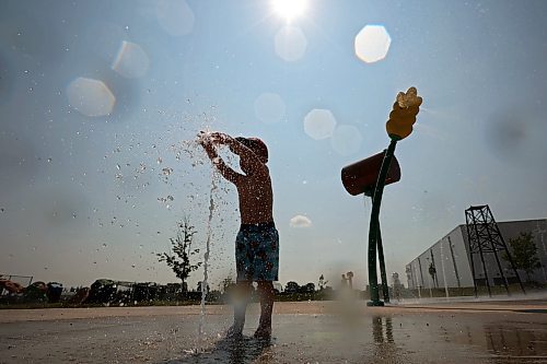 10072024
Three-year-old Kesler Davies of Cromer plays in the cool water at the Virden Spray Park on a scorching hot Wednesday afternoon. Environment Canada has forecast the heatwave to last through the weekend before daytime highs return to the mid 20&#x2019;s early next week.
(Tim Smith/The Brandon Sun)