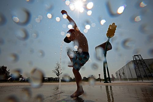 10072024
Three-year-old Kesler Davies of Cromer plays in the cool water at the Virden Spray Park on a scorching hot Wednesday afternoon. Environment Canada has forecast the heatwave to last through the weekend before daytime highs return to the mid 20&#x2019;s early next week.
(Tim Smith/The Brandon Sun)