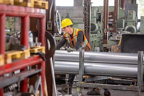 BROOK JONES / FREE PRESS
A worker moves galvanized steel tubing from the producrtion area into the warehouse at Imperial Steel at 901 Century St., in Winnipeg, Man., Thursday, July 11, 2024.