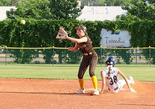 Westman Magic shortstop Mya Duncan-Gagnon waits for the throw to arrive from the plate as Manitoba Angels baserunner Kennedy Carriere of Winnipeg (38) slides into second base safely during the first game of a Manitoba Premier Softball League under-15 doubleheader against the Manitoba Angels on Thursday evening at Ashley Neufeld Softball Complex. (Perry Bergson/The Brandon Sun)