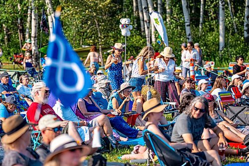 NIC ADAM / FREE PRESS
The 49th edition of the Winnipeg Folk Festival kicks off Thursday night with a music lineup that includes Lucinda Williams and Winnipeg’s Roman Clarke.
Tarp markers poke out of the crowd at the main stage at Winnipeg Folk Festival Thursday afternoon.
240711 - Thursday, July 11, 2024.

Reporter: Eva Wasney