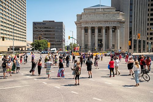 BROOK JONES / FREE PRESS
A round dance takes place at the intersection of Portage Avenue and Main Street in Winnipeg, Man., on the afternoon of Thursday, July 11, 2024. The round dance was organized following the announcement that a judge ruled serial killer Jeremy Anthony Michael Skibicki is criminally responsible for slaying four indigenous women in Winnipeg in early 2022.