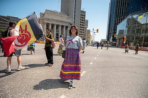 BROOK JONES / FREE PRESS
Winnipeg resident Jessica Courchene, who is from Sagkeeng First Naiton, is pictured following a round dance at the intersection of Portage Avenue and Main Street in Winnipeg, Man., on the afternoon of Thursday, July 11, 2024. The round dance was organized following the announcement that a judge ruled serial killer Jeremy Anthony Michael Skibicki is criminally responsible for slaying four indigenous women in Winnipeg in early 2022.