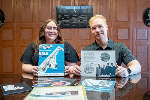 BROOK JONES / FREE PRESS
Kayla Bobrowski (left) and her brother Dylan are pictured holding old promotional material as they sit in the boardroom at Imperial Steel at 901 Century St., in Winnipeg, Man., Thursday, July 11, 2024. The brother-sister duo are junior executives and the fourth generation at Imperial Steel.