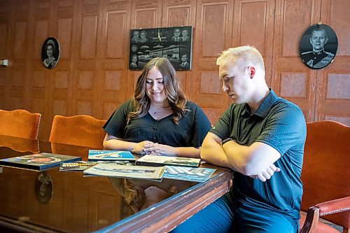 BROOK JONES / FREE PRESS
Kayla Bobrowski (left) and her brother Dylan are pictured looking at old brochures and promotional material while sitting in the boardroom at Imperial Steel at 901 Century St., in Winnipeg, Man., Thursday, July 11, 2024. The brother-sister duo are junior executives and the fourth generation at Imperial Steel.