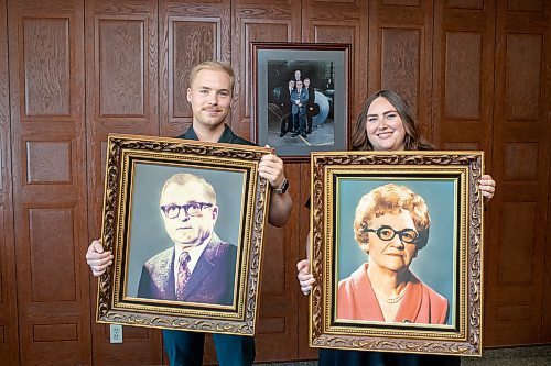 BROOK JONES / FREE PRESS
Dylan Bobrowski (left) and his sister Kayla are pictured holding portraits of their great-grandparents Henry Bobrowski (left) and Elsa (right) while standing in the boardroom at Imperial Steel at 901 Century St., in Winnipeg, Man., Thursday, July 11, 2024. The photo hanging on the wall features their father David Bobrowski (back row), grandfather Victor Bobrowski (front row: middle), and uncles Richard Bobrowski (front row: left) and Deryl Bobrowski (front row: right). The brother-sister duo are junior executives and the fourth generation at Imperial Steel.