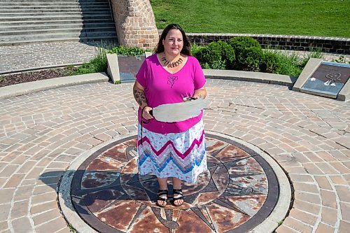 BROOK JONES / FREE PRESS
Jaime Grasby who is an indigenous story teller and knowledge keeper holds a feather fan and a smudging shell as she is pictured at the Oodena Celebration Circle at The Forks in Winnipeg, Man., Thursday, July 11, 2024.