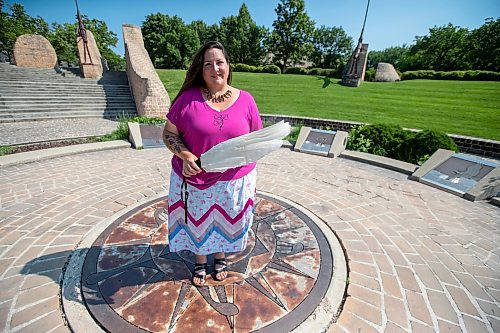 BROOK JONES / FREE PRESS
Jaime Grasby who is an indigenous story teller and knowledge keeper holds a feather fan and a smudging shell as she is pictured at the Oodena Celebration Circle at The Forks in Winnipeg, Man., Thursday, July 11, 2024.