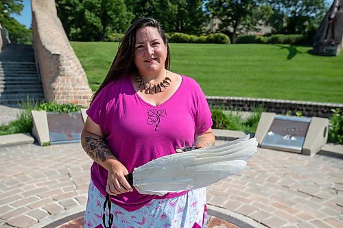 BROOK JONES / FREE PRESS
Jaime Grasby who is an indigenous story teller and knowledge keeper holds a feather fan and a smudging shell as she is pictured at the Oodena Celebration Circle at The Forks in Winnipeg, Man., Thursday, July 11, 2024.