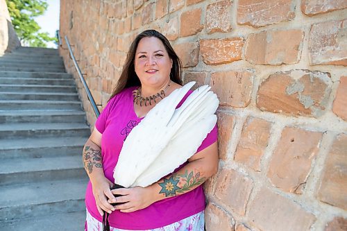 BROOK JONES / FREE PRESS
Jaime Grasby, 43, who is an indigenous story teller and knowledge keeper holds a smuding feather fans as she is pictured at the Oodena Celebration Circle at The Forks in Winnipeg, Man., Thursday, July 11, 2024.