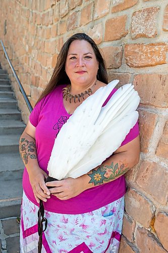 BROOK JONES / FREE PRESS
Jaime Grasby, 43, who is an indigenous story teller and knowledge keeper holds a smuding feather fans as she is pictured at the Oodena Celebration Circle at The Forks in Winnipeg, Man., Thursday, July 11, 2024.