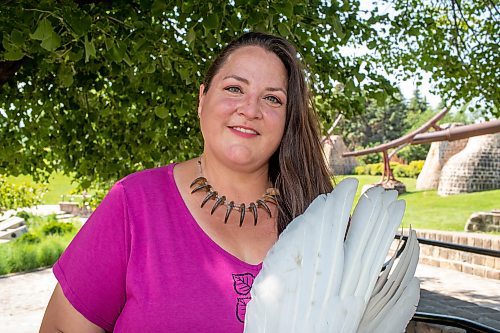 BROOK JONES / FREE PRESS
Jaime Grasby, 43, who is an indigenous story teller and knowledge keeper holds a smuding feather fans as she is pictured at the Oodena Celebration Circle at The Forks in Winnipeg, Man., Thursday, July 11, 2024.