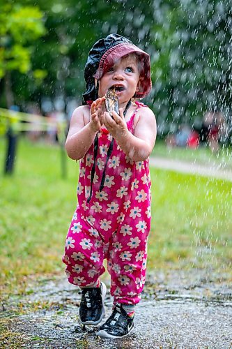 NIC ADAM / FREE PRESS
15-month-year-old Blake Bennett plays in the water of one of the cooling stations at the Winnipeg Folk Festival Friday afternoon.
240712 - Friday, July 12, 2024.

Reporter: ?
