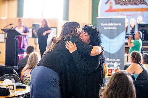 MIKAELA MACKENZIE / FREE PRESS

Minister of housing, addictions, and homelessness Bernadette Smith (left) hugs Aboriginal Health & Wellness Centreճ executive director Della Herrera at a safer consumption site announcement at the Aboriginal Health & Wellness Centre on Friday, July 12, 2024. 

For Malak story.

