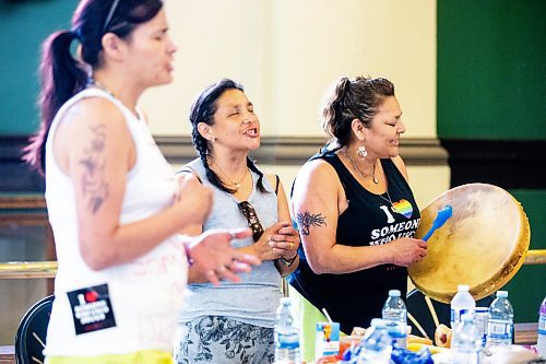 MIKAELA MACKENZIE / FREE PRESS

Peers with lived and living experience Angie Fleury (left), Dawn Lavand, and Wanda LaRonde sign and drum after a safer consumption site announcement at the Aboriginal Health &amp; Wellness Centre on Friday, July 12, 2024. 

For Malak story.

