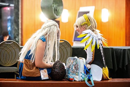 MIKAELA MACKENZIE / FREE PRESS

El Bruchanski (left) and Bee Hill leaf through the program at Ai-Kon at the RBC Convention Centre on Friday, July 12, 2024. 

Standup.

