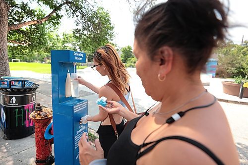 Ruth Bonneville / Free Press

Local - Hydration Stations

Madison and her mom Priscilla stop to fill up a water bottle with water at the hydration station located at 185 Young Street.  

The City of Winnipeg has hydration stations throughout the city to cool off and access clean drinking water.  

July 12th,  2024

