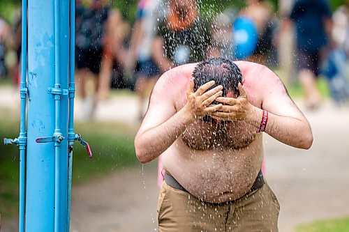 NIC ADAM / FREE PRESS
Eamon Doyle, of San Francisco, cools off from the heat at one of the cooling stations at the Winnipeg Folk Festival Friday afternoon. It&#x2019;s his 3rd time attending the festival in 26 years making it a decennial tradition for him.
240712 - Friday, July 12, 2024.

Reporter: ?
