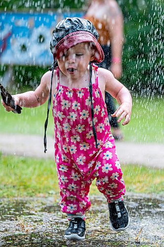 NIC ADAM / FREE PRESS
15-month-year-old Blake Bennett plays in the water of one of the cooling stations at the Winnipeg Folk Festival Friday afternoon.
240712 - Friday, July 12, 2024.

Reporter: ?
