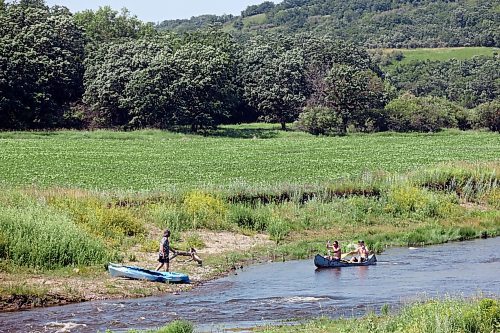 12072024
Paddlers in a kayak and a canoe paddle down the Little Saskatchewan River west of Brandon on a scorching hot Friday.
(Tim Smith/The Brandon Sun)