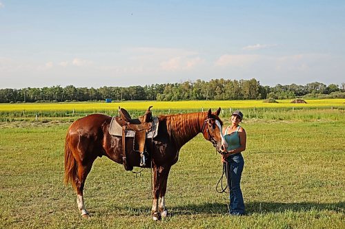 12072024
Tori Colosimo and her running bred quarter horse Sox pose for a portrait after taking part in an advanced barrel racing clinic led by Shannon Kerr, a horse trainer and barrel racer living in Brazil, at the Austin Stampede grounds on a scorching hot Thursday. Colosimo trains horses as well and is training Sox for his first year competing in barrel racing. (Tim Smith/The Brandon Sun)