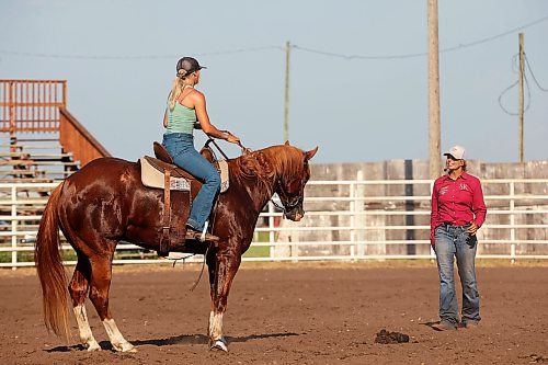 12072024
Tori Colosimo and her running bred quarter horse Sox listen to tips from Shannon Kerr, a horse trainer and barrel racer living in Brazil, during an advanced barrel racing clinic at the Austin Stampede grounds on a scorching hot Thursday. Before arriving in Manitoba, Kerr led clinics in Saskatchewan, Alberta and BC. (Tim Smith/The Brandon Sun)