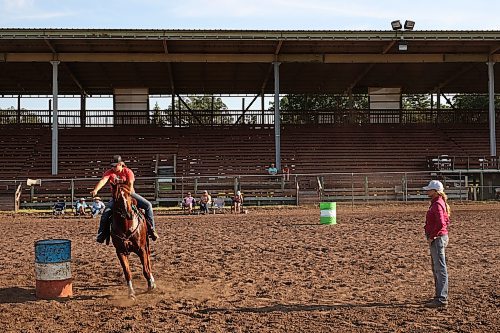 12072024
Shannon Kerr (R), a horse trainer and barrel racer living in Brazil, watches the technique of Jacey Boyes and her horse Stark as they round a barrel during an advanced barrel racing clinic led by Kerr at the Austin Stampede grounds on a scorching hot Thursday. Before arriving in Manitoba, Kerr led clinics in Saskatchewan, Alberta and BC. (Tim Smith/The Brandon Sun)