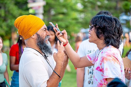 NIC ADAM / FREE PRESS
The 49th edition of the Winnipeg Folk Festival kicks off Thursday night with a music lineup that includes Lucinda Williams and Winnipeg&#x2019;s Roman Clarke.
Jagmeet Singh poses for a fan&#x2019;s photo at the Winnipeg Folk Festival Thursday evening.
240711 - Thursday, July 11, 2024.

Reporter: Eva Wasney